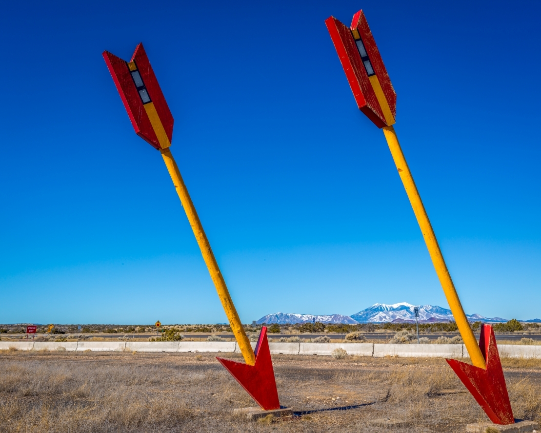 two giant arrows hitting the ground
