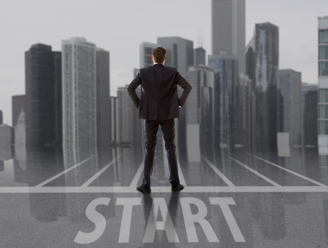 businessman looking ahead from the starting line